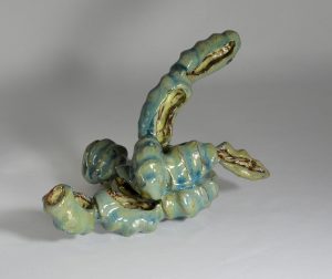 A teal-coloured abstract sculpture